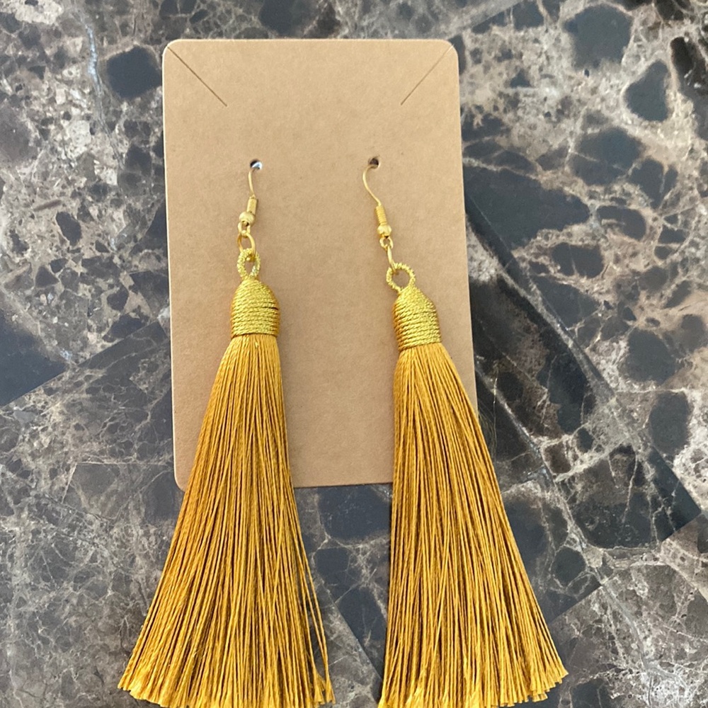 Yellow tassel earrings.